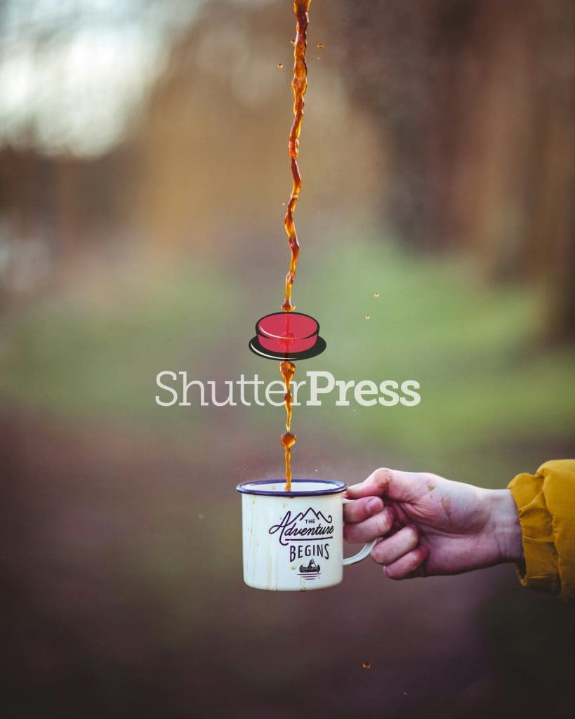 Coffee pouring into enamel camping mug with The Adventure Begins design, outdoors in nature, ShutterPress watermark