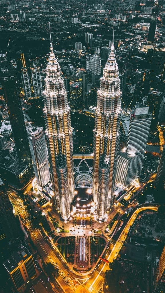 Photo by Izuddin Helmi Adnan on Unsplash Petronas Twin Towers illuminated at night above Kuala Lumpur city skyline Malaysia
